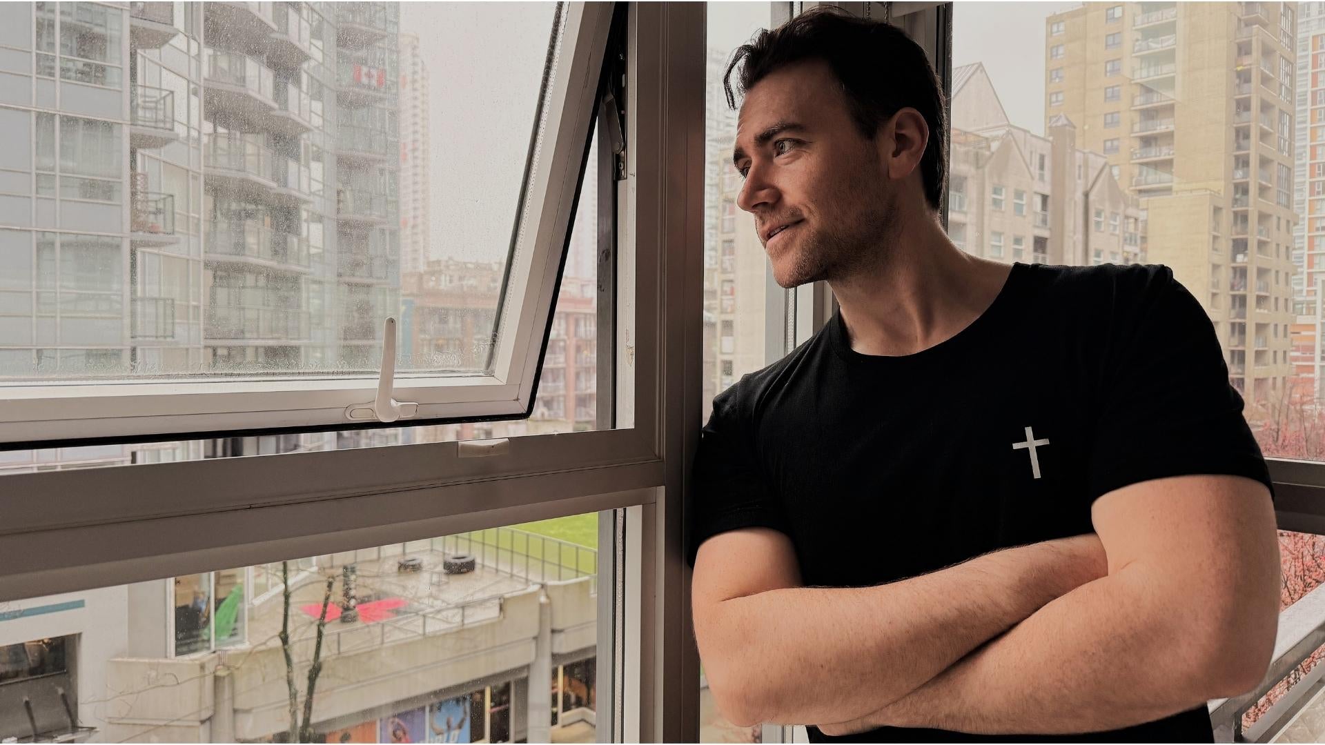 Handsome man in black christian t shirt